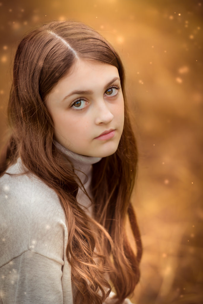 Family photographer Edinburgh - headshot of 12 year old girl with brown eyes and long brown hair