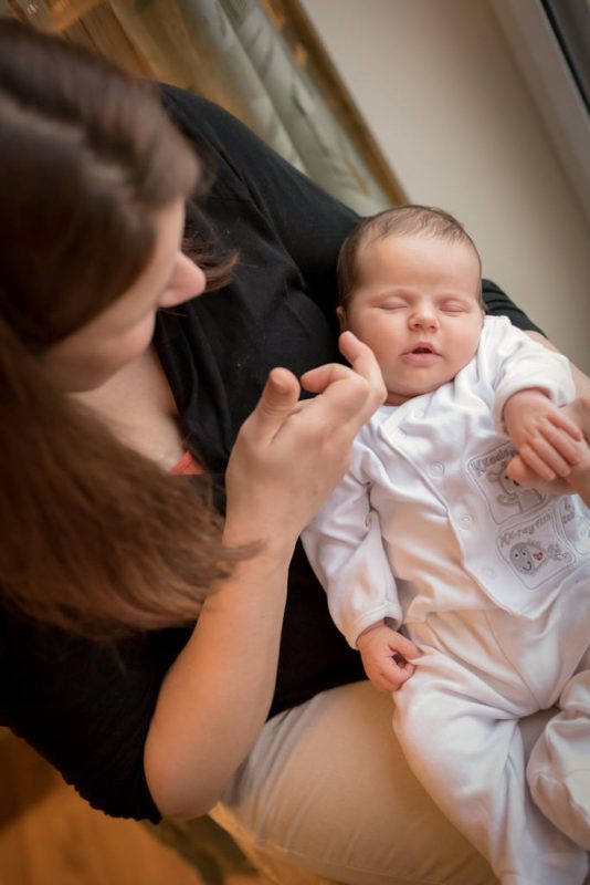 importance of existing in photographs - baby girl sitting on mother's knee