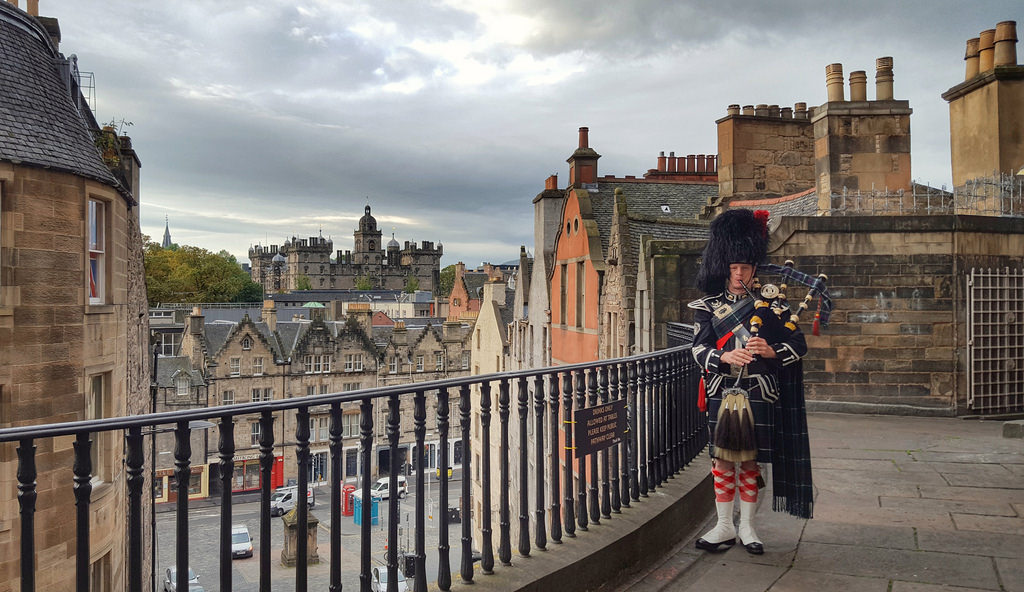 Piper in full highland dress on Victoria Terrace Edinburgh