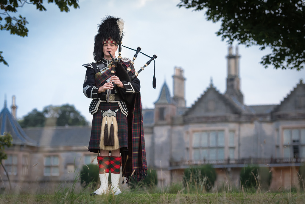 Wedding piper in full highland dress at Lauriston Castle