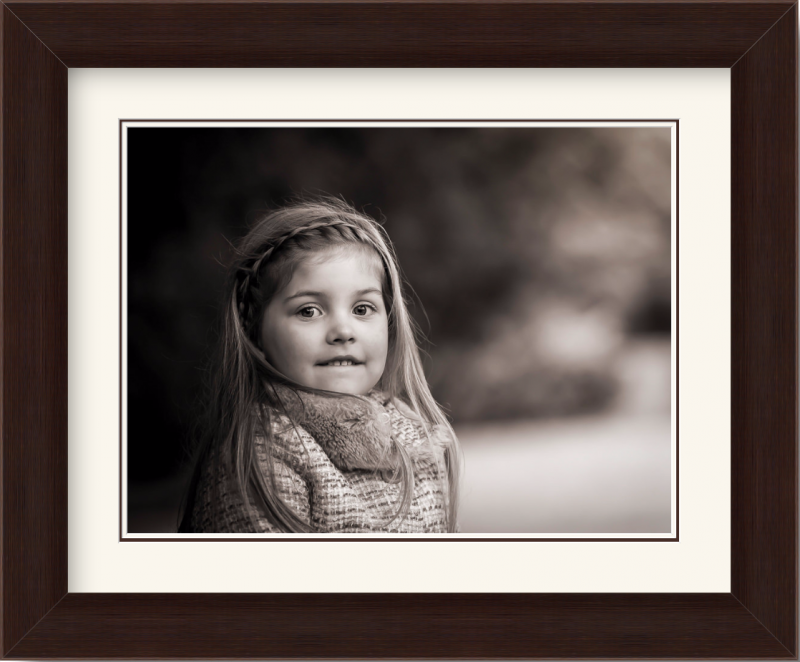 Family photographs help children's self-esteem - framed sepia portrait of little girl