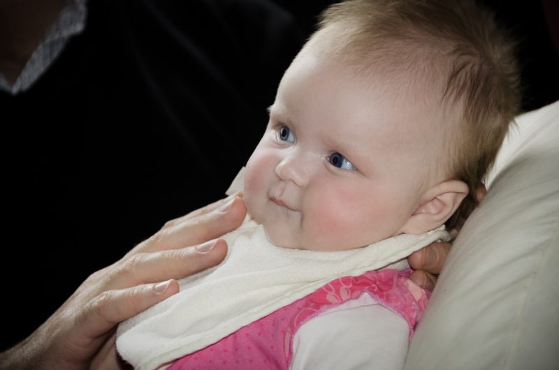 Father holding 6 month old baby girl