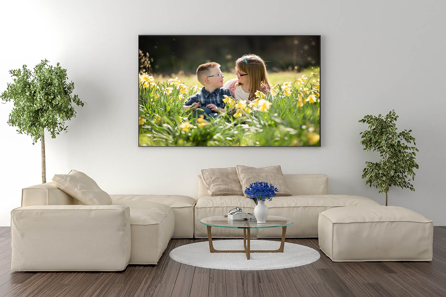 Living room with large picture frame on wall of little boy and girl sitting in daffodils
