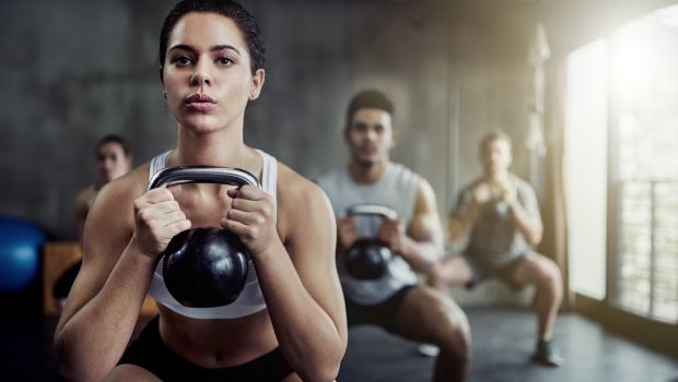 Woman holding kettlebell doing exercise