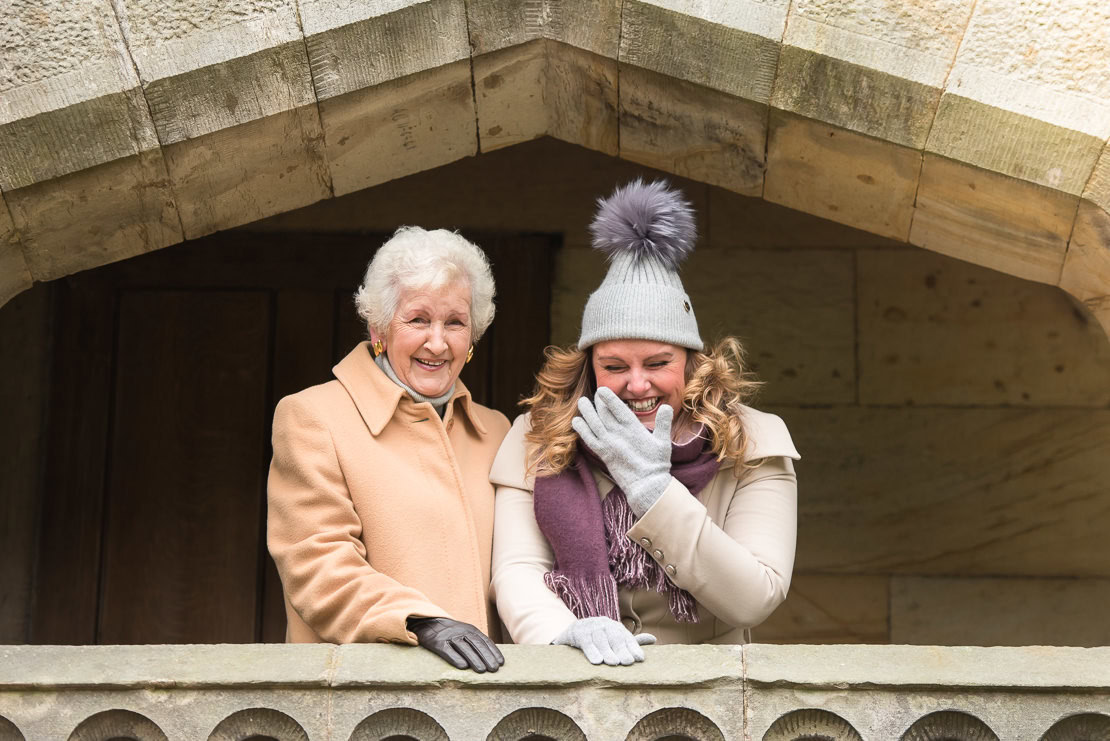 fun family photography in Edinburgh - mother and grownup daughter laughinng