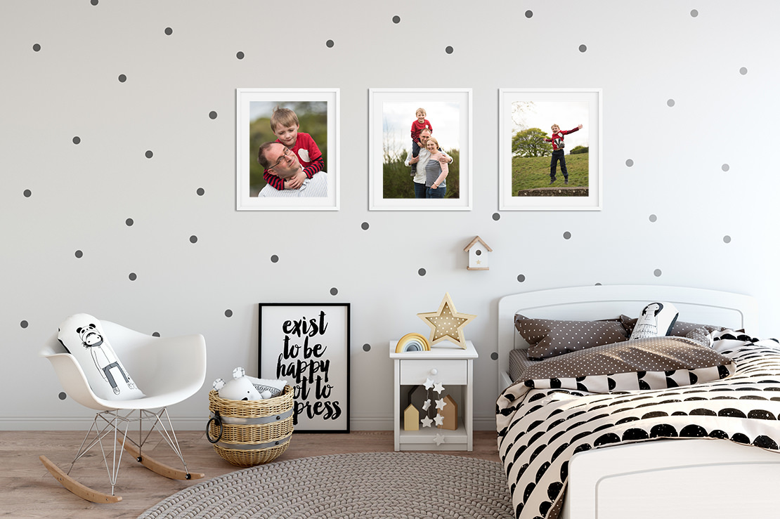 Edinburgh Portrait Photographers - Trio of white framed family portraits on childs bedroom wall