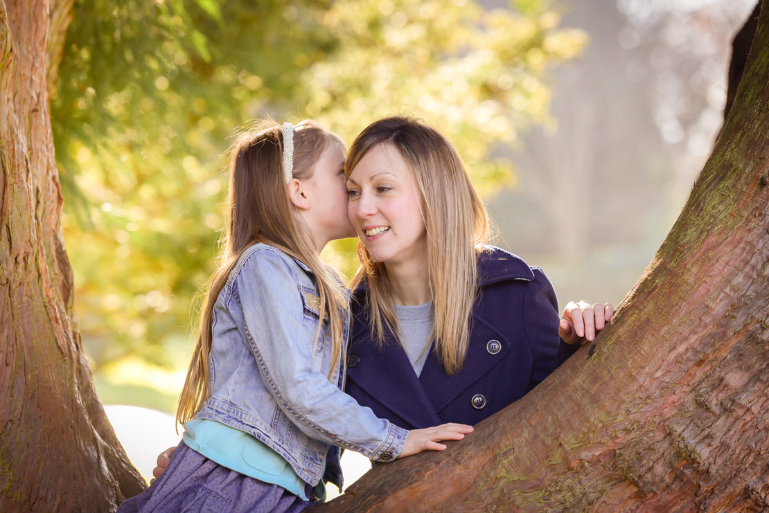 Best family photographer Edinburgh - daughter whispering into mothers ear
