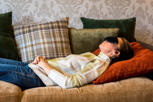 Personal branding photography photoshoot for business consultant in Edinburgh, Scotland - woman lying sleeping on couch with eyemask on