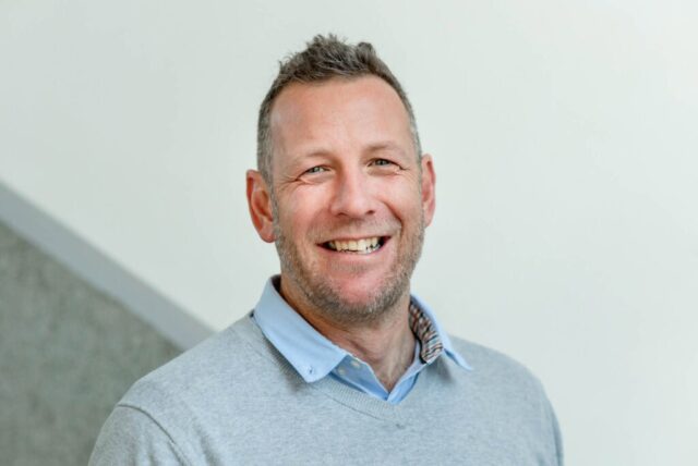 Brand photographer Edinburgh Scotland - headshot of man with short grey hair and beard