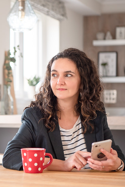 Personal Branding Photographer Edinburgh - Donna Green - woman sititng with coffee cup and phone