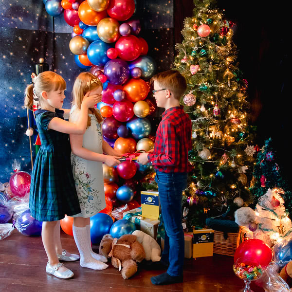 Children giving Christmas presents