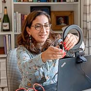 Woman with laptop ringlight