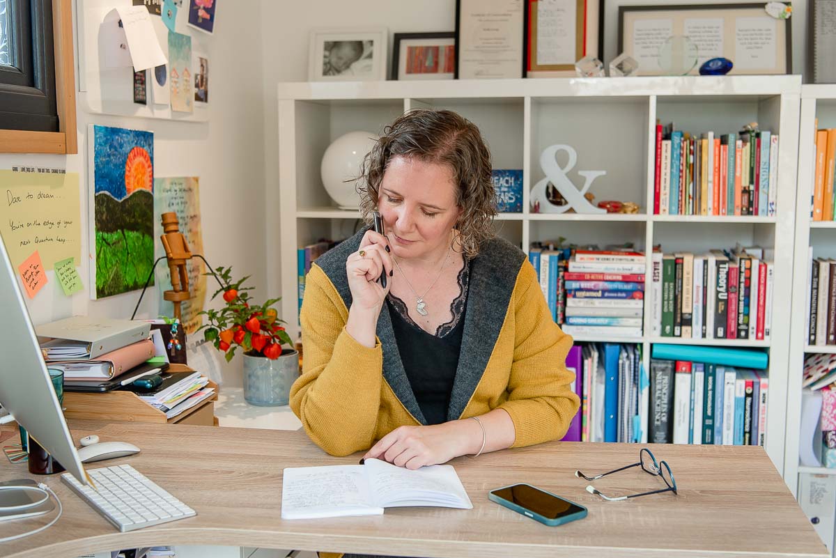 Woman looking down at notebook