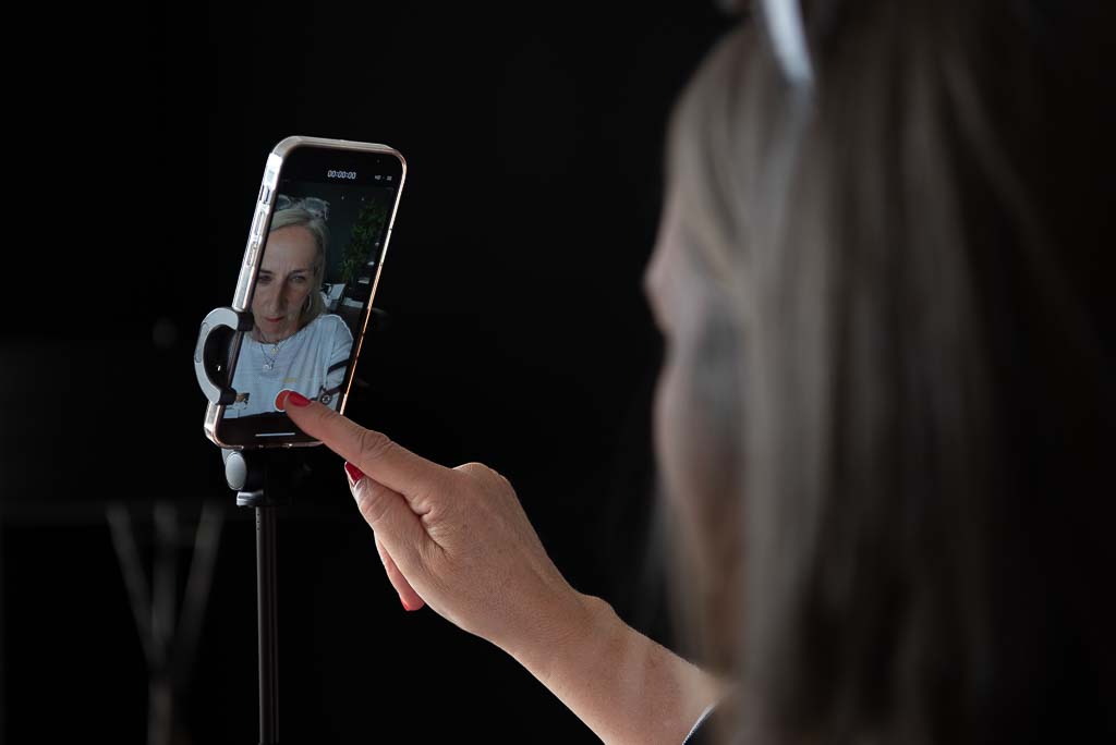 Brand photographer Glasgow woman taking selfie on phone