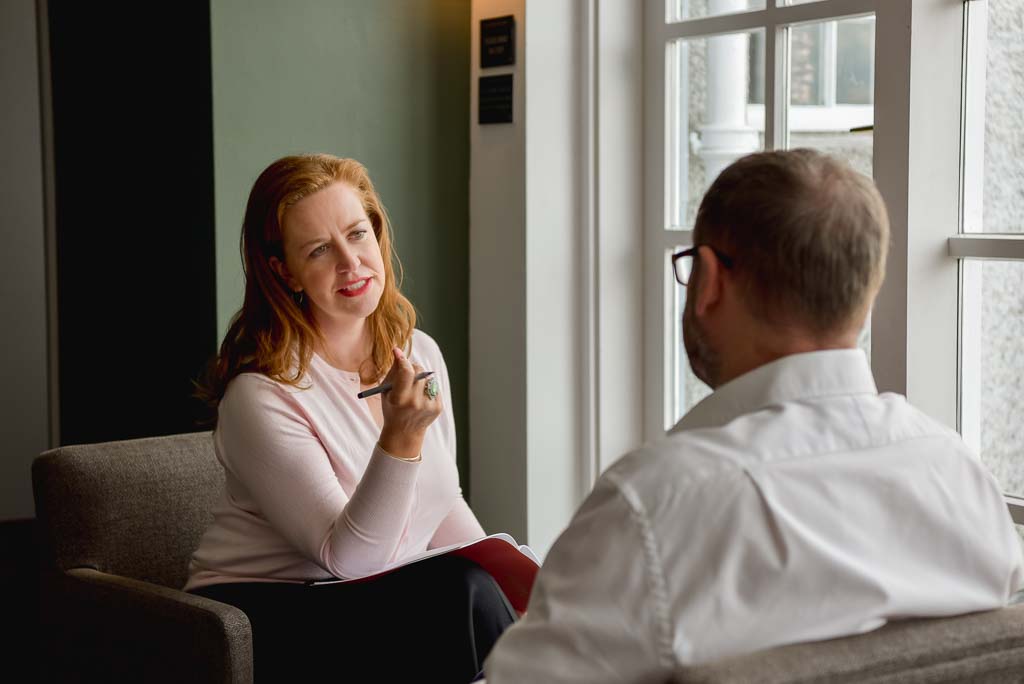 Personal brand photography Edinburgh – business owner in conversation with client during a session in Scotland