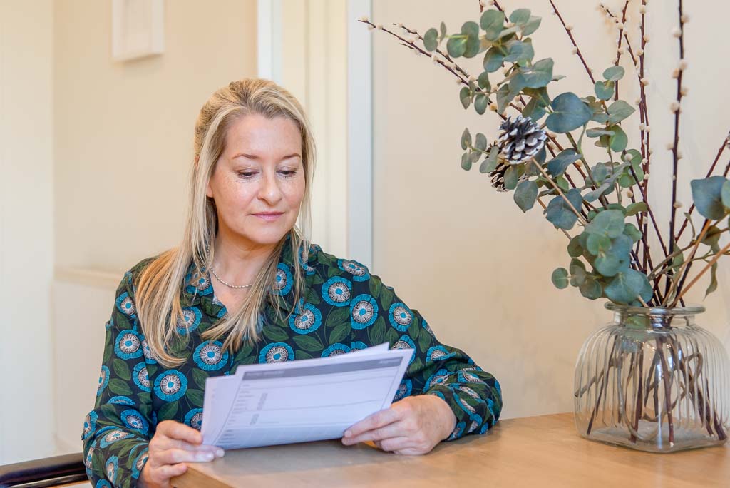 Brand photographer Edinburgh woman reading documents