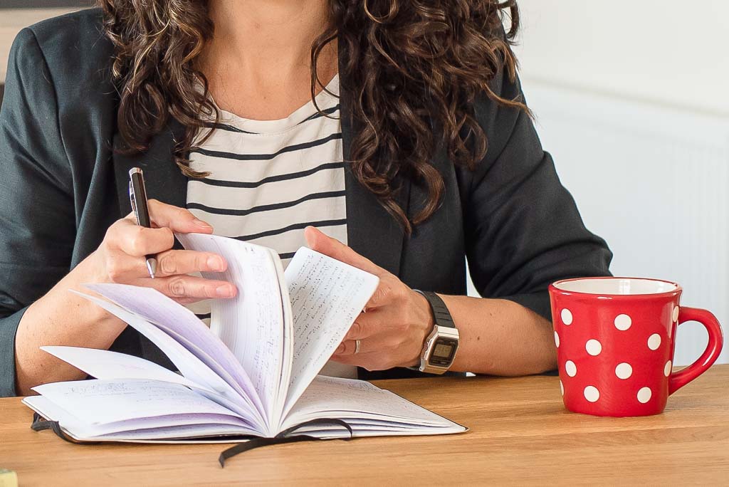 Brand photographer Edinburgh woman reading notebook