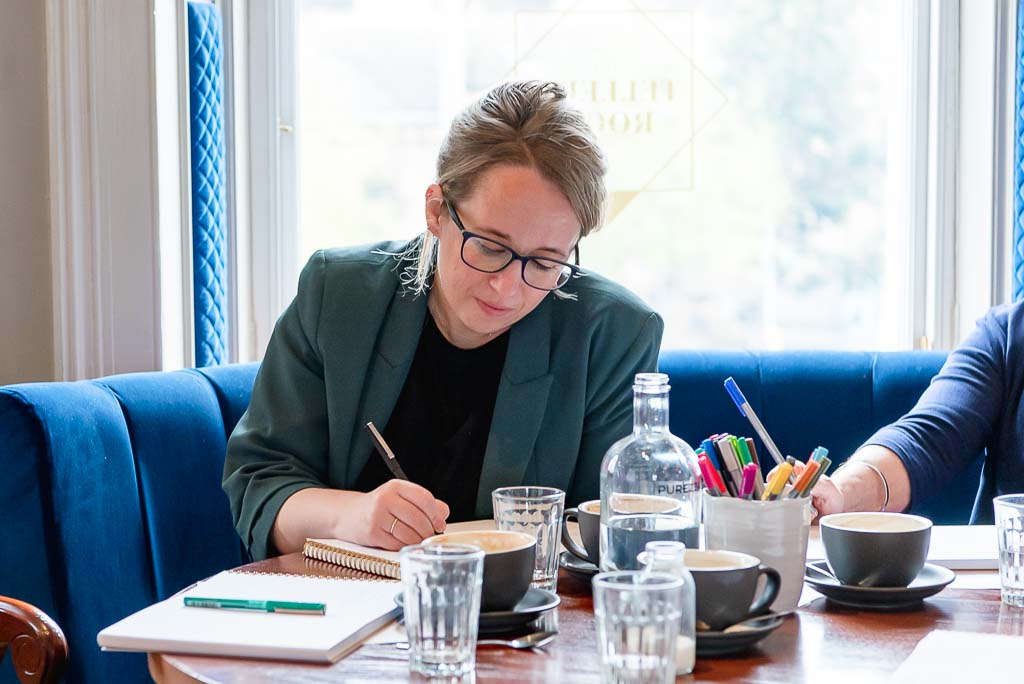 Brand photographer Edinburgh woman writing