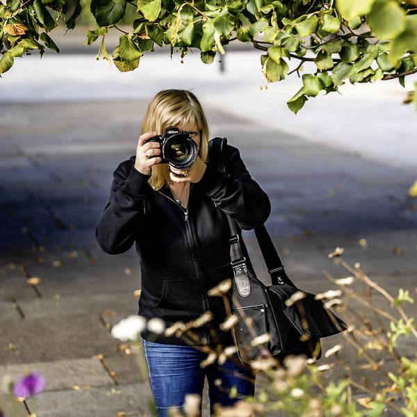 Brand photographer Edinburgh Scotland on brand photo shoot with camera