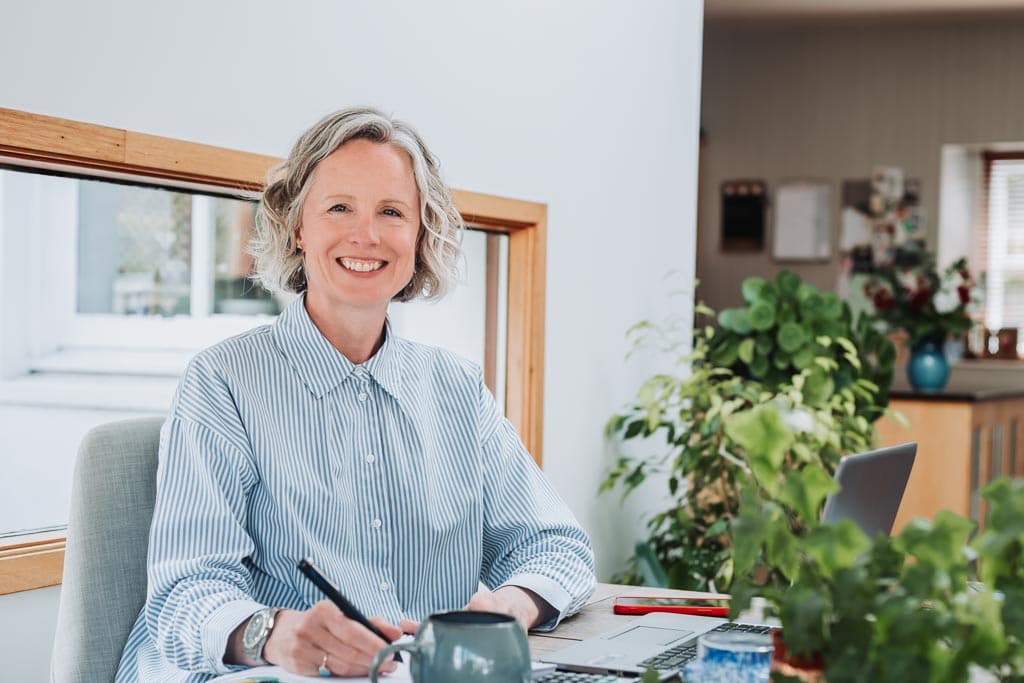 Brand photography for executive assistants in Edinburgh, Scotland - Sarah Whigham working at her laptop during her Edinburgh brand photography session