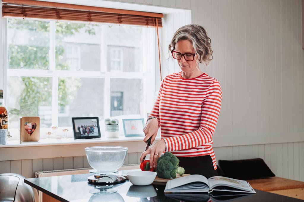 Edinburgh brand photography session for Executive Coach in Scotland - scene showing cooking in kitchen