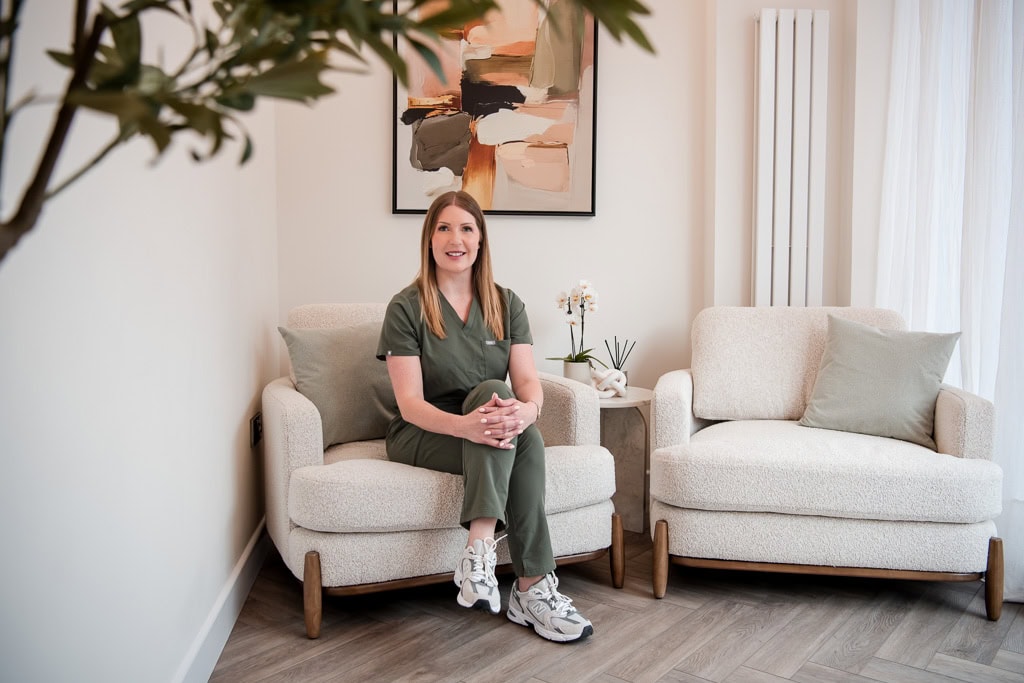 Feeling ready for brand photography - aesthetician small business owner in  Edinburgh Scotland sitting in her clinic