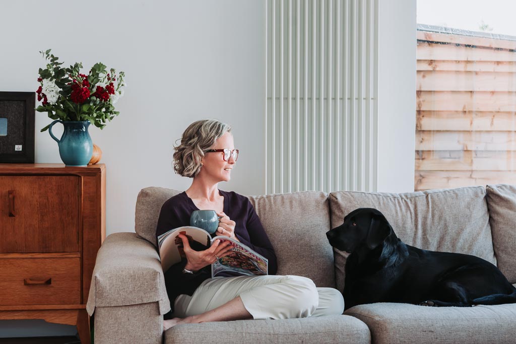 Executive assistant Sarah Whigham with her black Labrador Henry during her brand photography session in Edinburgh, Scotland