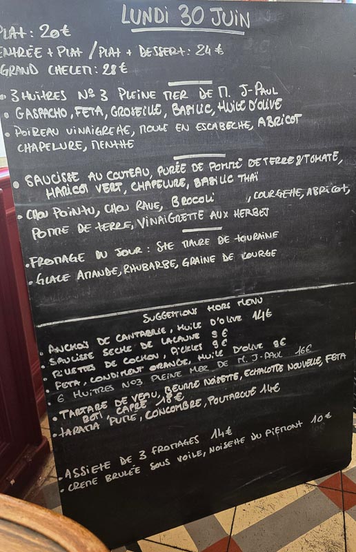 Showing the real you in brand photography - chalkboard showing menu in French in a cafe in Paris