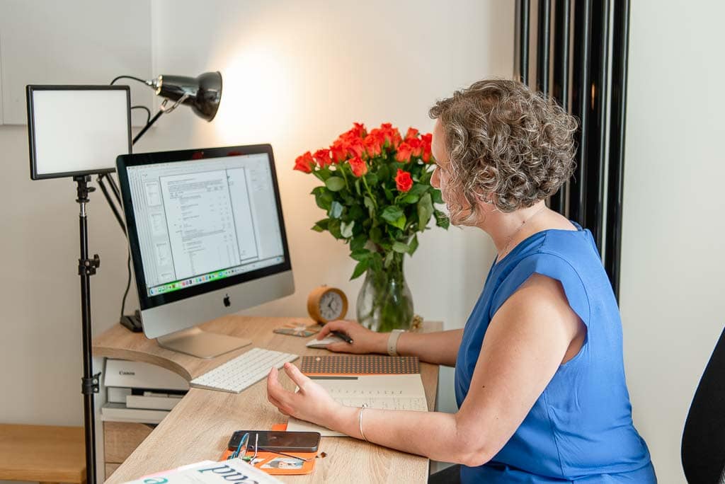 Brand photoshoot in Edinburgh, Scotland, showing a business owner working at her desk during a full day brand photography session