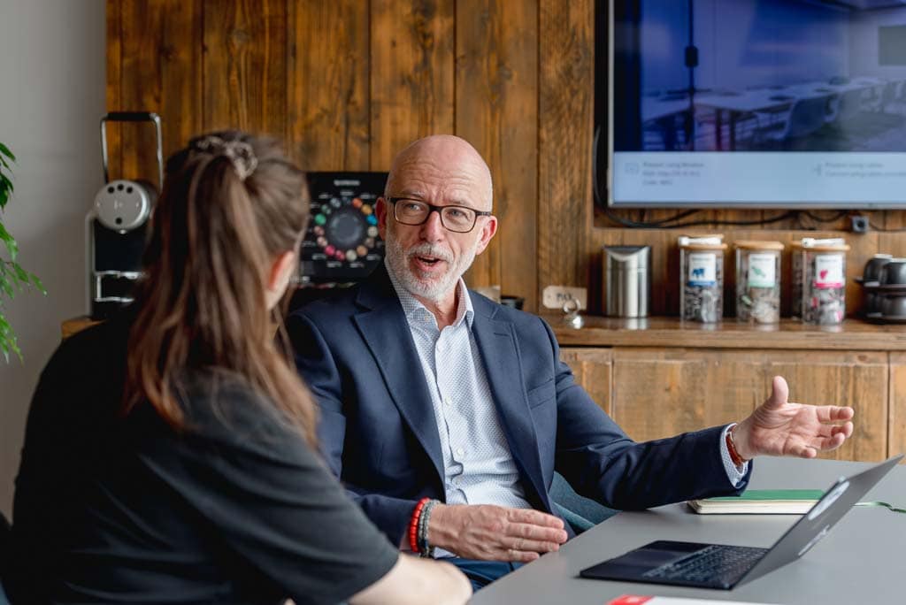 Brand photography Edinburgh – independent professional speaking with client during a one-to-one consultation