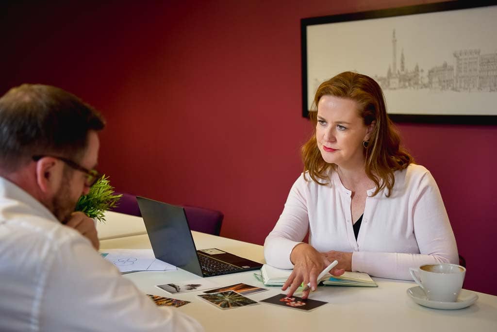 Full day brand photoshoot in Edinburgh or across Scotland for service-based small businesses - female business consultant discussing ideas with a client during a meeting